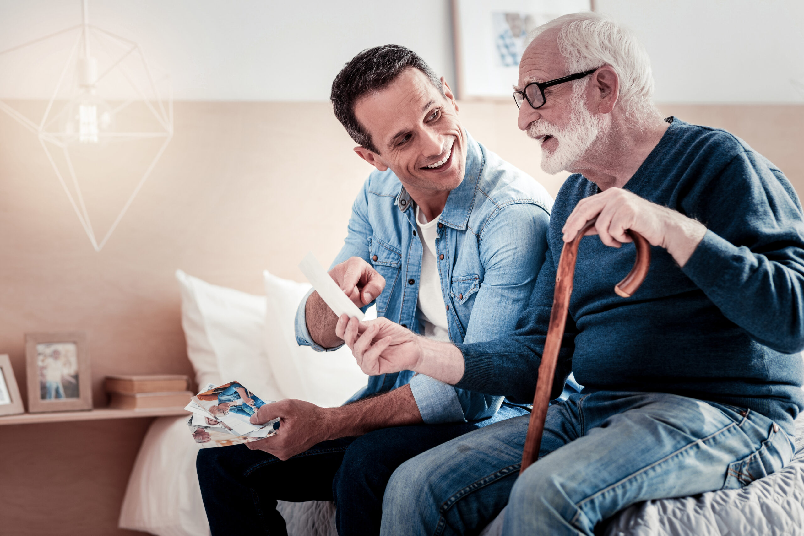 Two men discussing old memories with photos